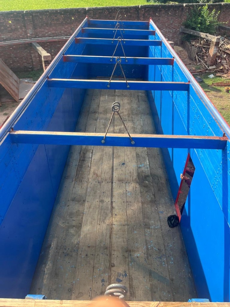 Closed truck body interior with timber floor